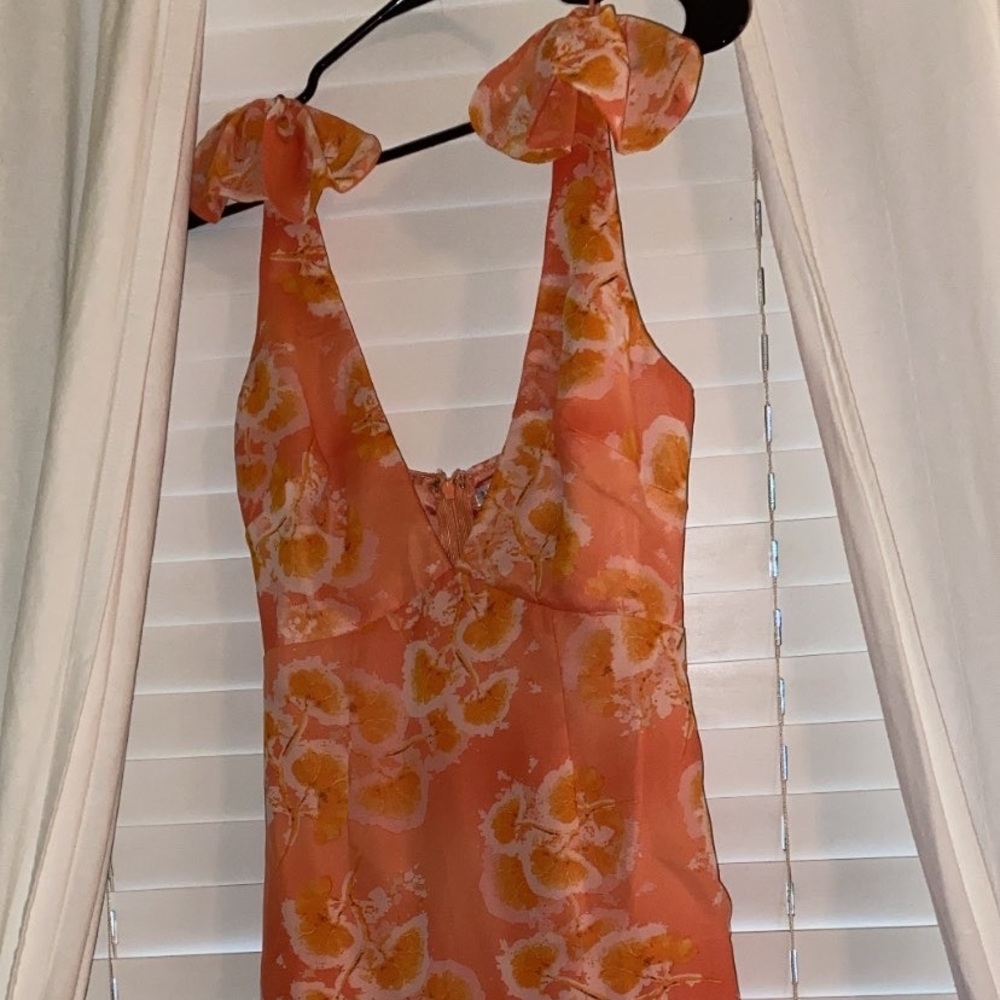 Orange frilly mini dress